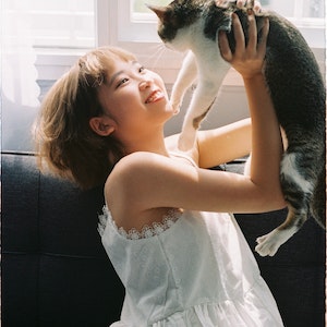 Woman enjoying cat company